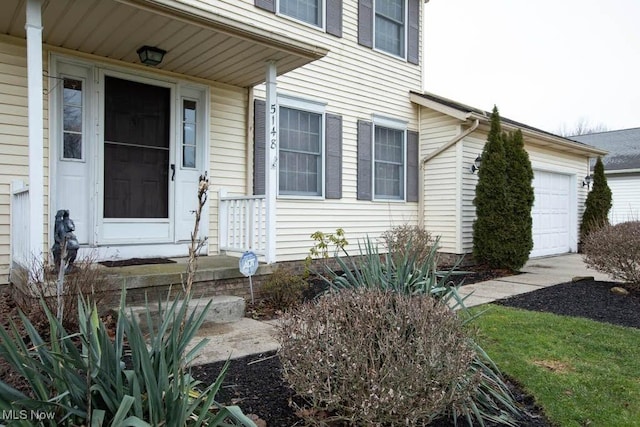 property entrance with a garage