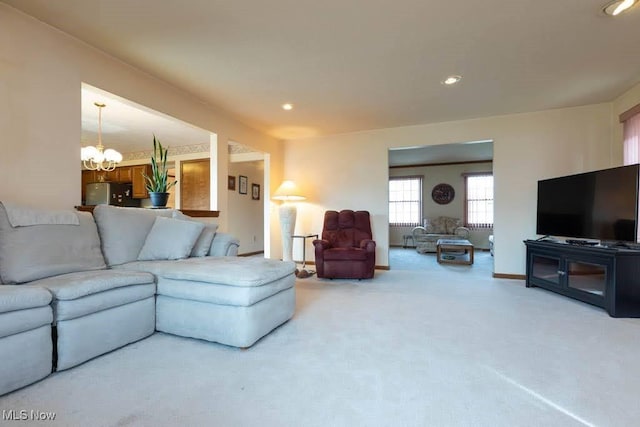 living room with a chandelier, recessed lighting, baseboards, and carpet