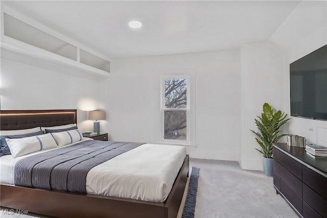 bedroom with light colored carpet