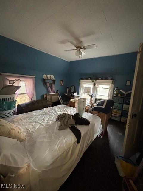 bedroom with ceiling fan and wood finished floors