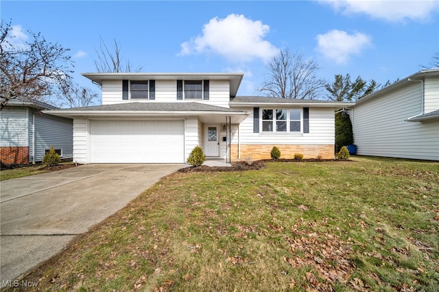 split level home with driveway, a front yard, and an attached garage