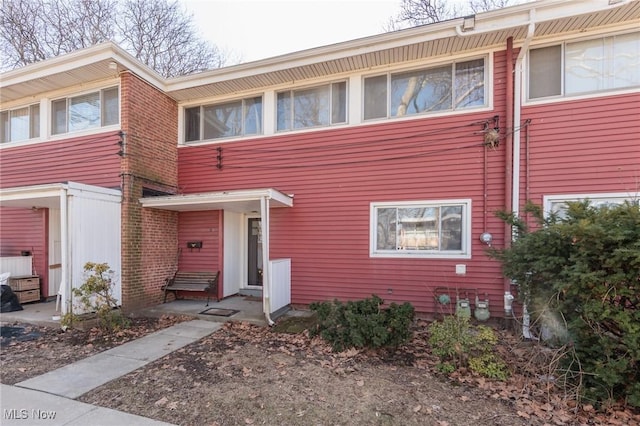 view of property with brick siding