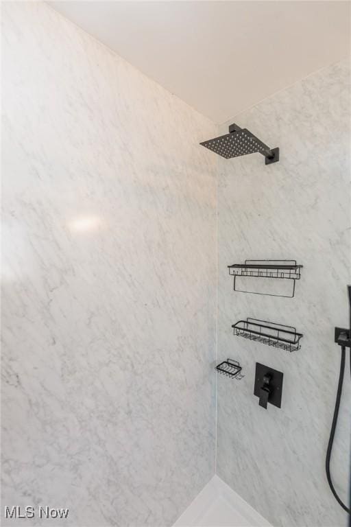 room details with a tile shower