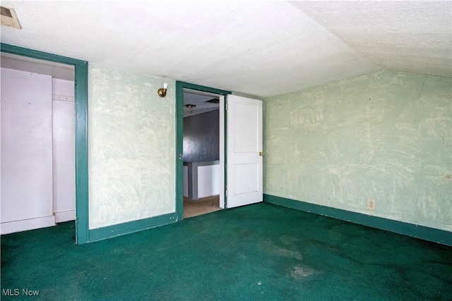 unfurnished bedroom with carpet flooring, baseboards, and visible vents