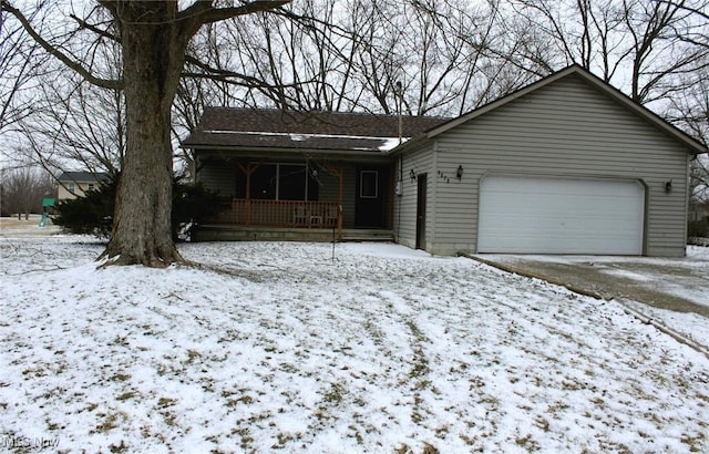 ranch-style home featuring a porch and an attached garage