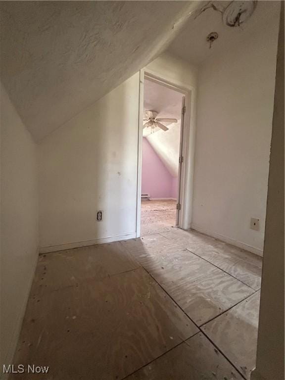 additional living space featuring vaulted ceiling