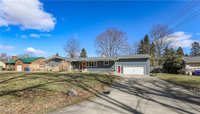 single story home with an attached garage, a chimney, driveway, and a front lawn