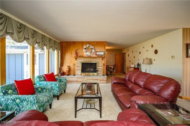 carpeted living area with a brick fireplace