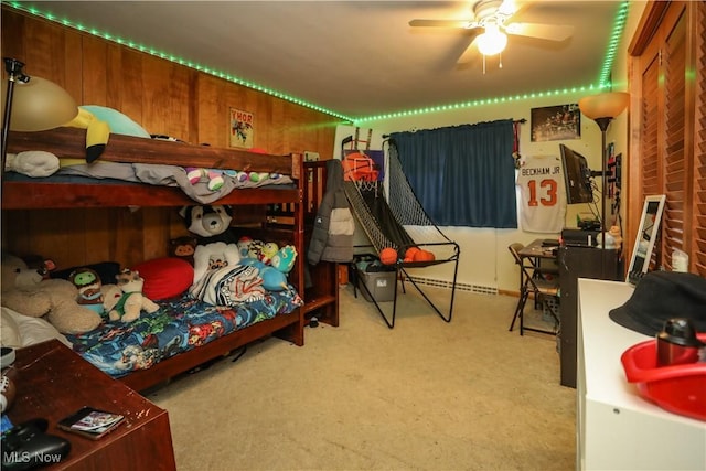 carpeted bedroom with wooden walls