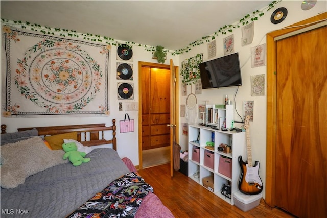 bedroom with wood finished floors