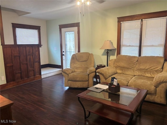 living area featuring wood finished floors and baseboards