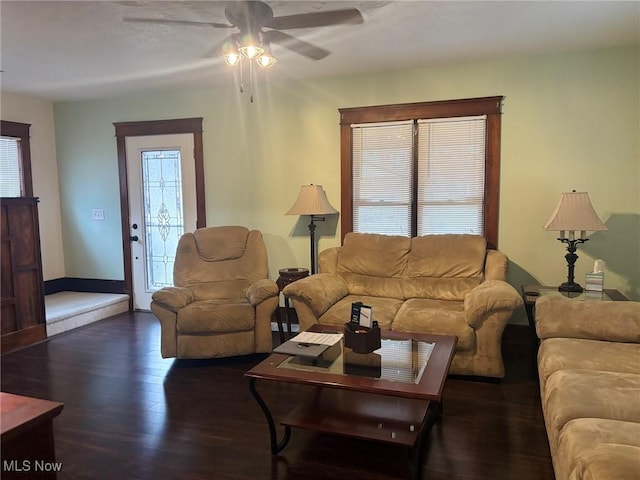 living room featuring ceiling fan and wood finished floors