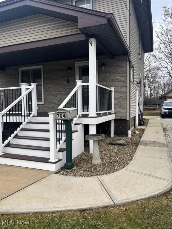 doorway to property with covered porch