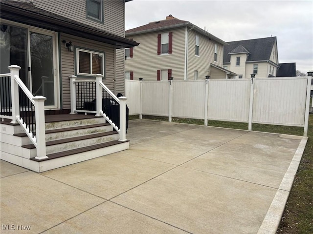 view of patio featuring fence