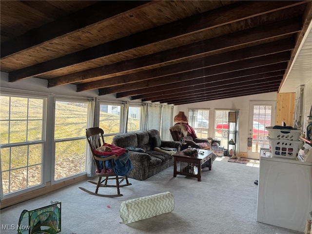 sunroom featuring wood ceiling, vaulted ceiling with beams, and washer / clothes dryer