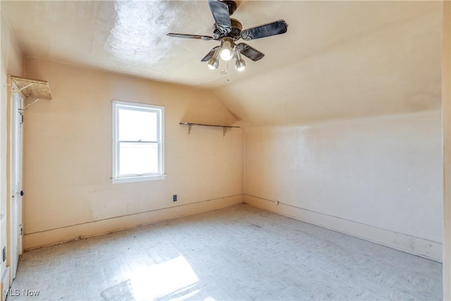 bonus room featuring lofted ceiling and a ceiling fan