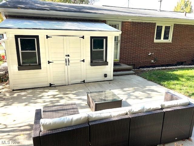 view of shed featuring outdoor lounge area