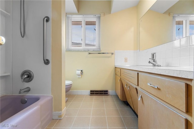 full bath featuring tasteful backsplash, plenty of natural light, tile patterned floors, and vanity