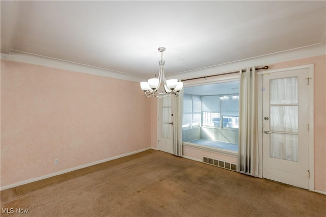 interior space featuring visible vents, baseboards, carpet, and an inviting chandelier