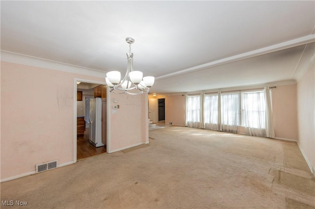 empty room featuring visible vents, baseboards, stairway, carpet floors, and an inviting chandelier