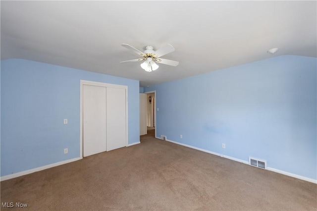 additional living space with visible vents, carpet floors, a ceiling fan, and vaulted ceiling