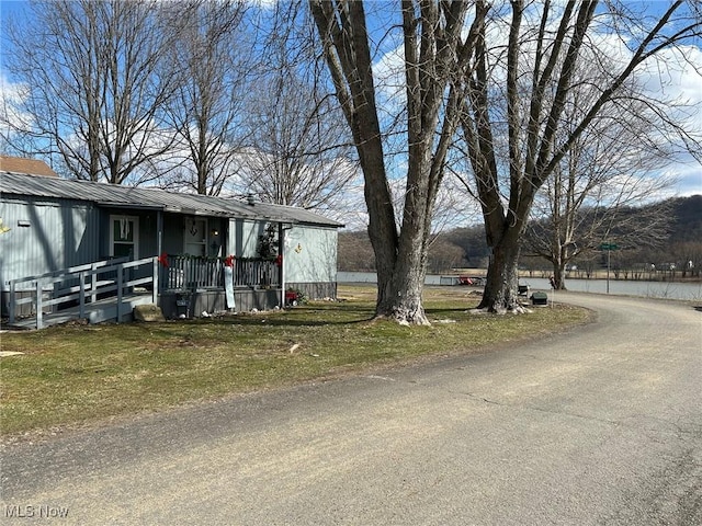 view of front of house with metal roof and covered porch