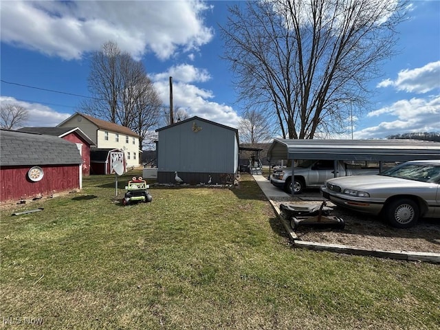 view of yard with an outbuilding, a carport, and a shed