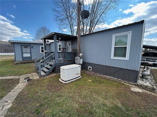 rear view of property with a yard