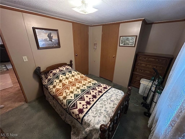 carpeted bedroom with a textured ceiling