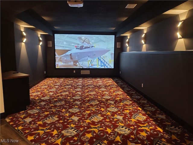 home theater with carpet flooring and baseboards