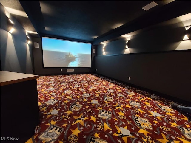 carpeted cinema with baseboards