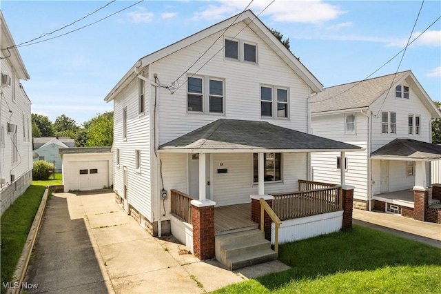 traditional style home with a detached garage, a porch, an outdoor structure, concrete driveway, and a shingled roof