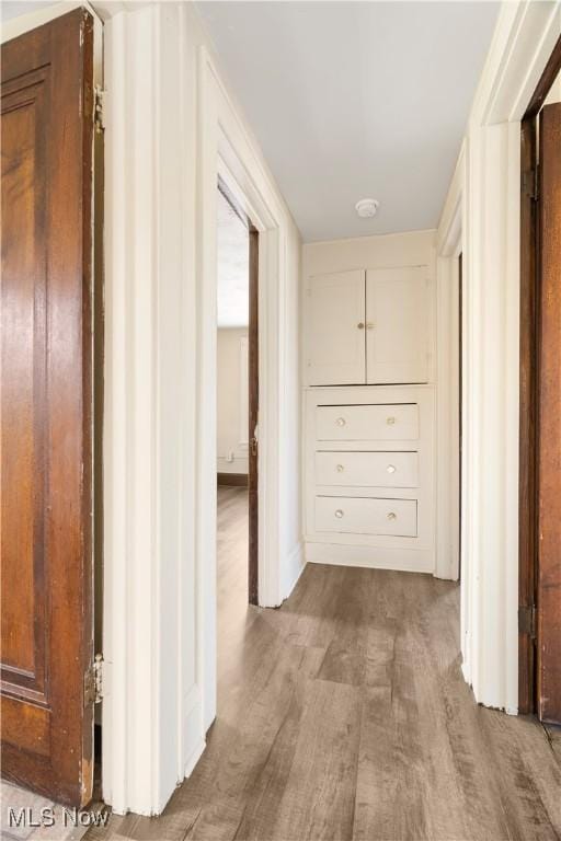 hallway with wood finished floors