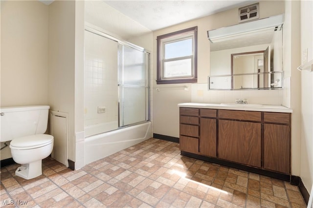 bathroom with vanity, visible vents, enclosed tub / shower combo, decorative backsplash, and toilet