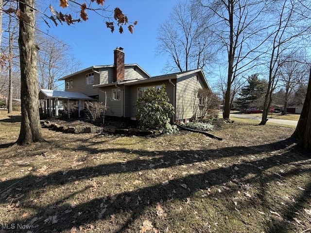 view of side of property featuring a chimney