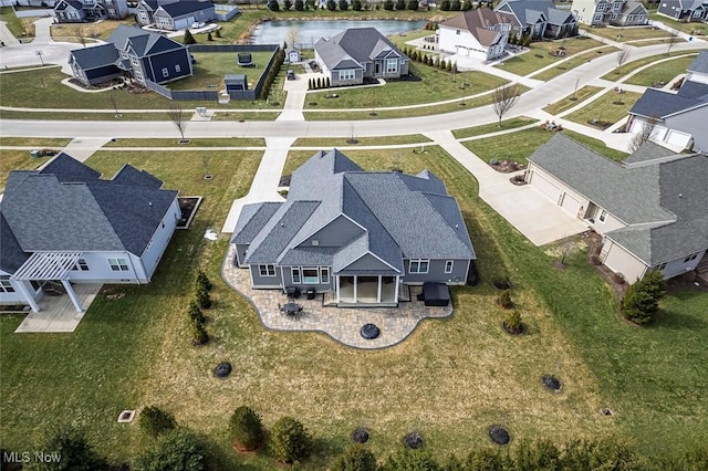 aerial view with a residential view and a water view