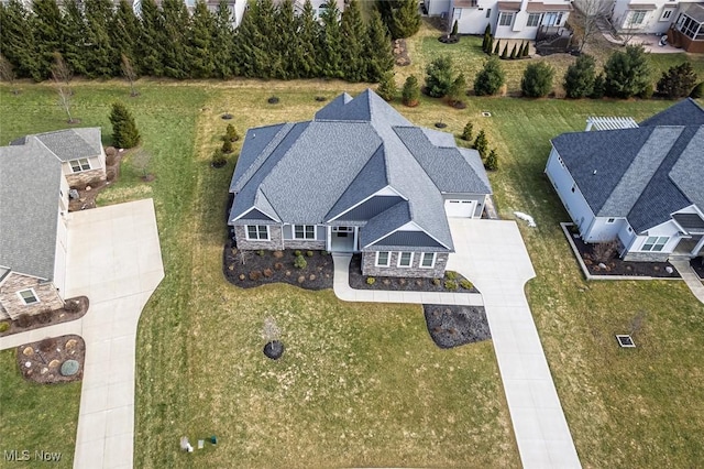 birds eye view of property with a residential view