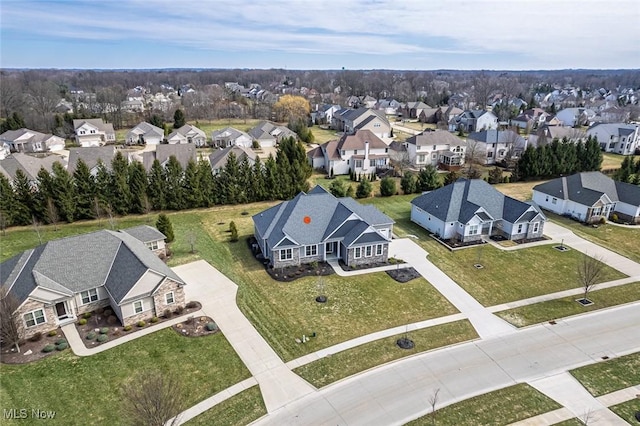 birds eye view of property with a residential view