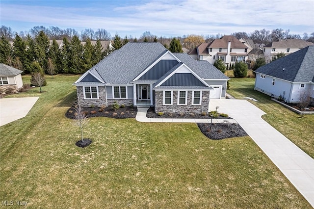 view of front facade featuring a front lawn, roof with shingles, board and batten siding, and driveway