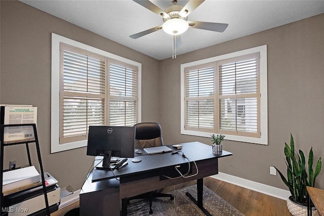 home office with wood finished floors, baseboards, and ceiling fan