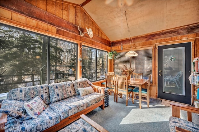 sunroom featuring lofted ceiling