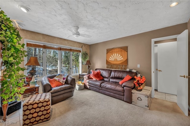 carpeted living room with tile patterned flooring and ceiling fan