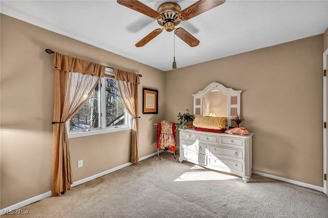 unfurnished bedroom with a ceiling fan, baseboards, and carpet floors