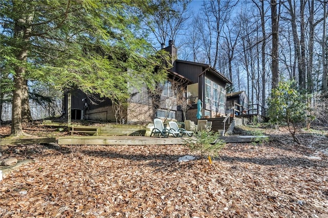 view of property exterior featuring a chimney