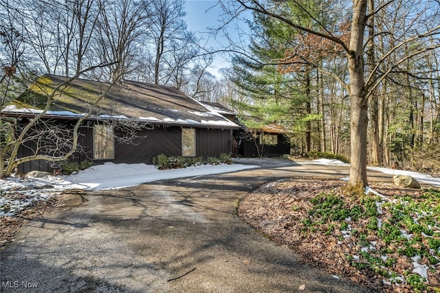 view of property exterior with driveway