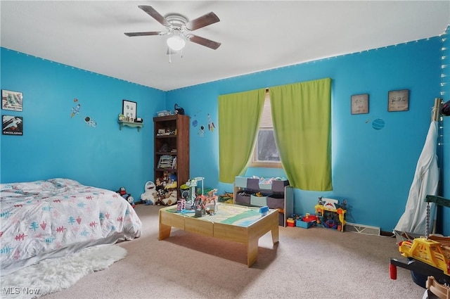 carpeted bedroom featuring a ceiling fan