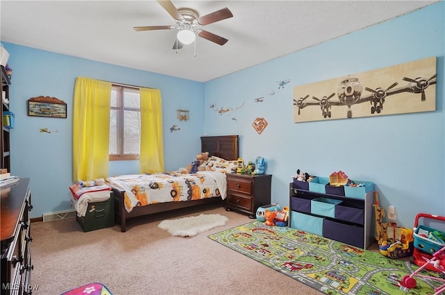 bedroom with baseboards, a ceiling fan, and carpet floors