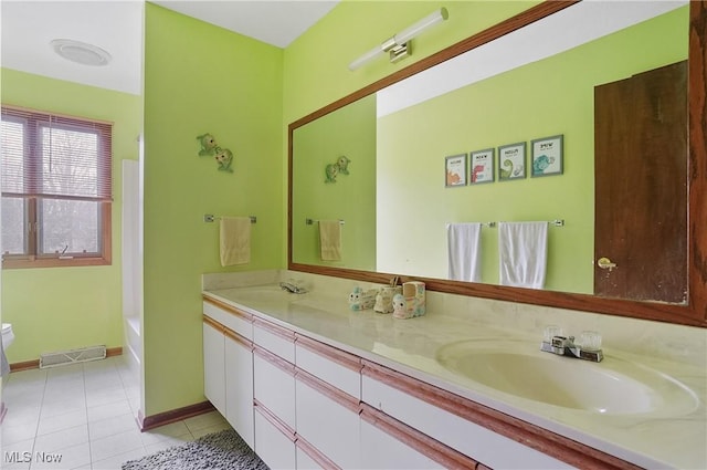 full bathroom with double vanity, visible vents, tile patterned floors, and a sink