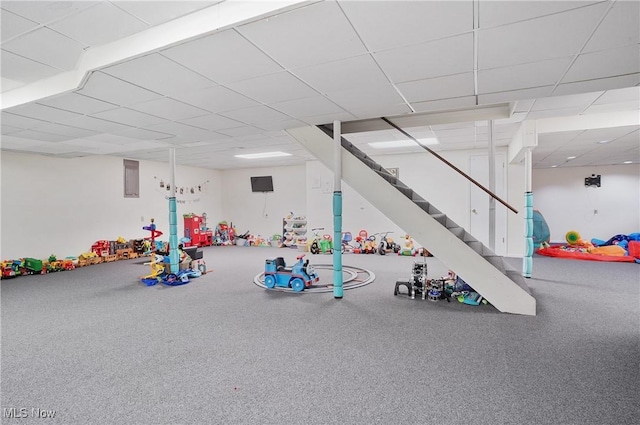 recreation room with a drop ceiling