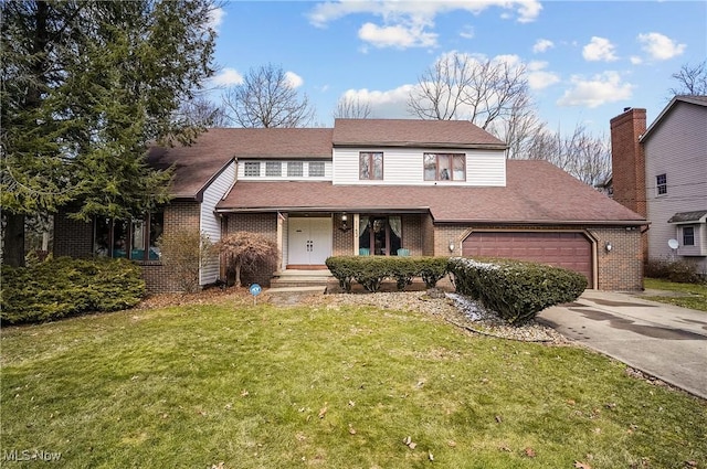 view of front of property featuring a shingled roof, a front lawn, concrete driveway, a garage, and brick siding